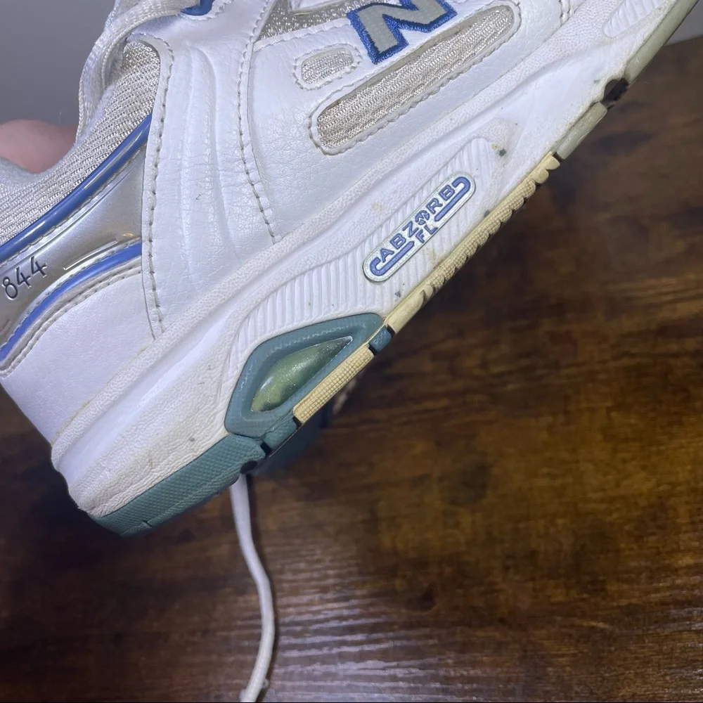 New Balance White Athletic Sneakers with Blue Accents